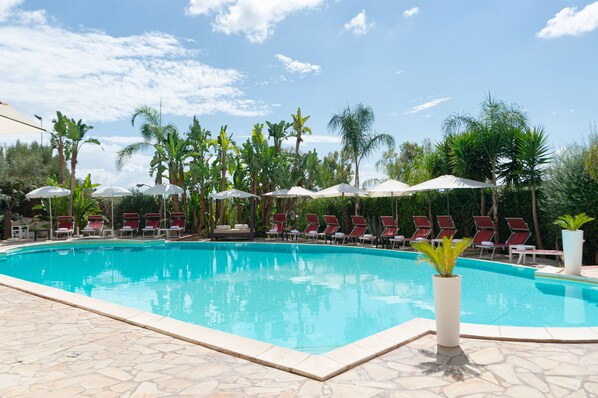 Outdoor pool, pool umbrellas, pool loungers