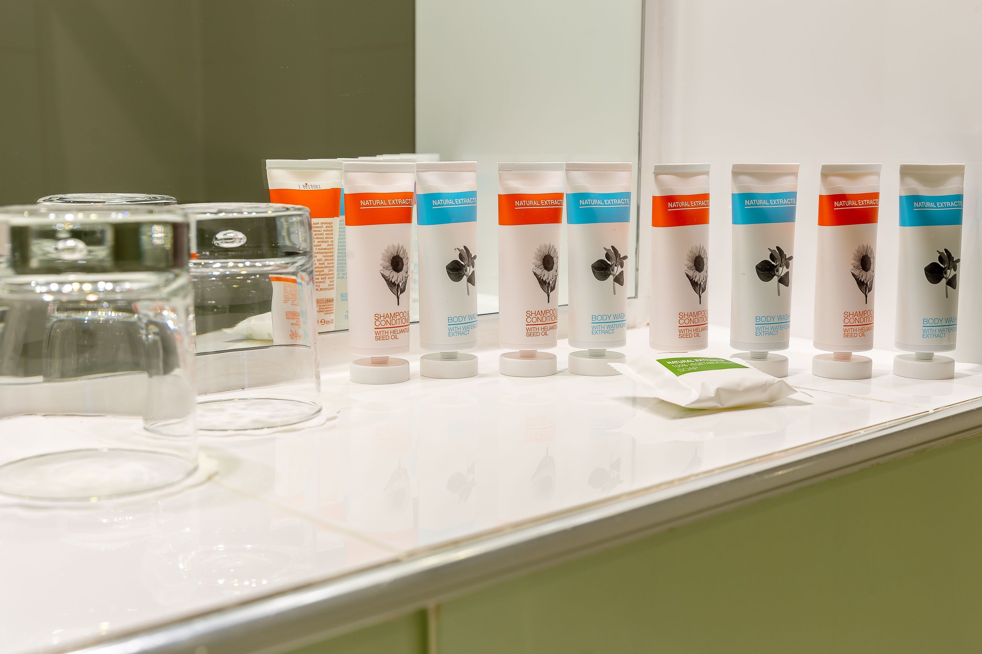 eco-friendly toiletries, hair dryer, towels