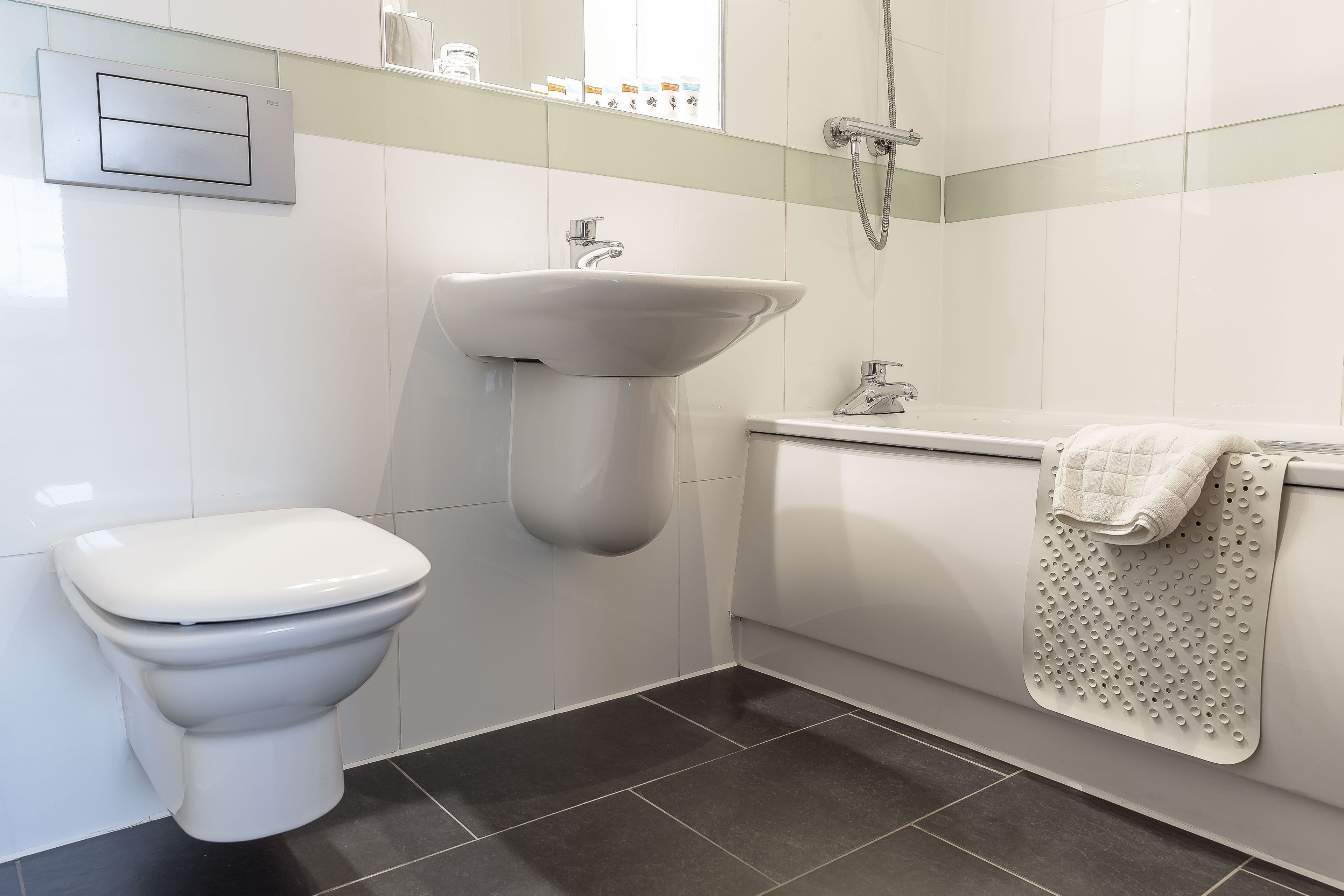 eco-friendly toiletries, hair dryer, towels