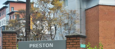 A sign for the Preston International Hotel.