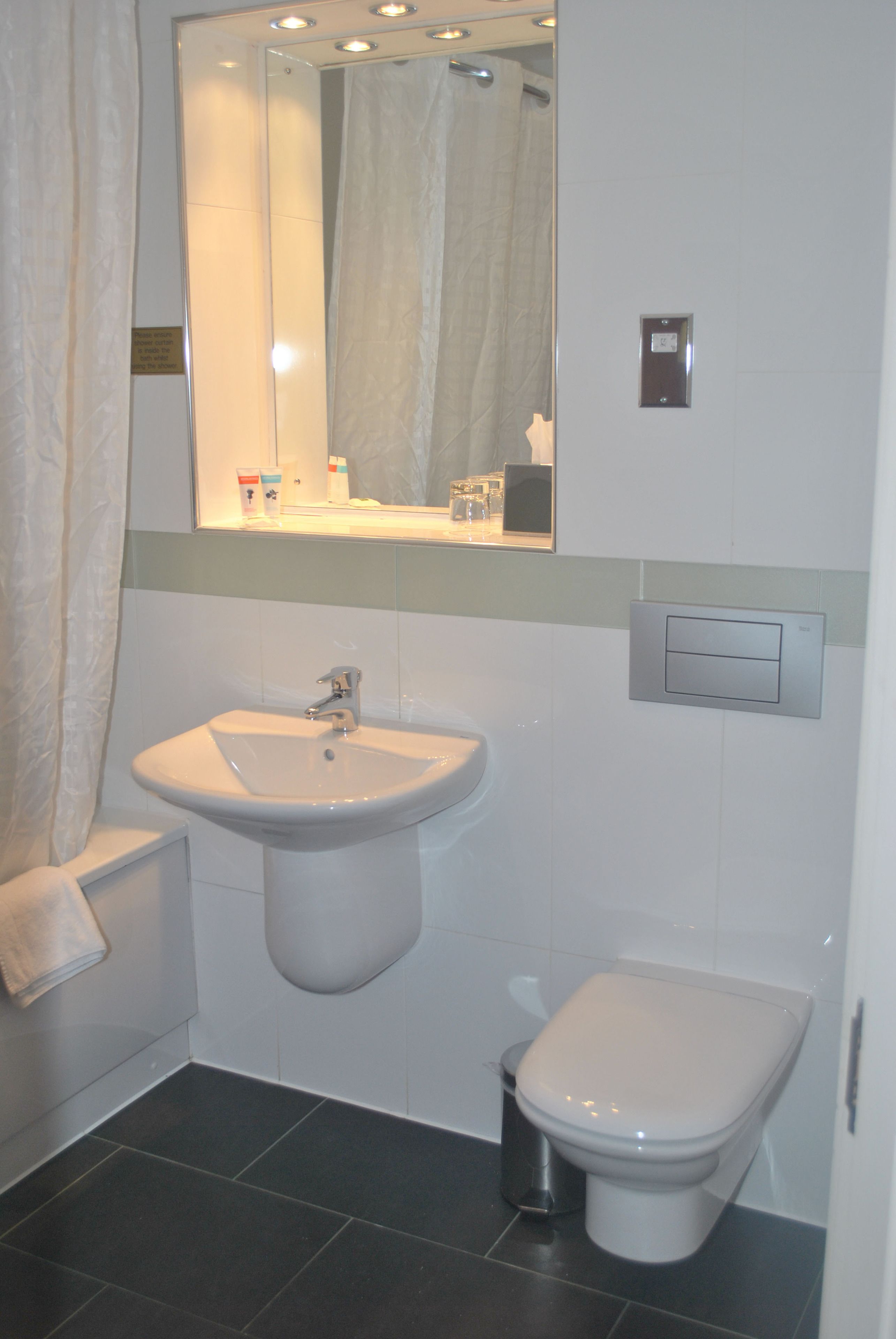 eco-friendly toiletries, hair dryer, towels