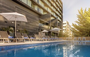 Seasonal outdoor pool, open noon to 8:00 PM, pool umbrellas
