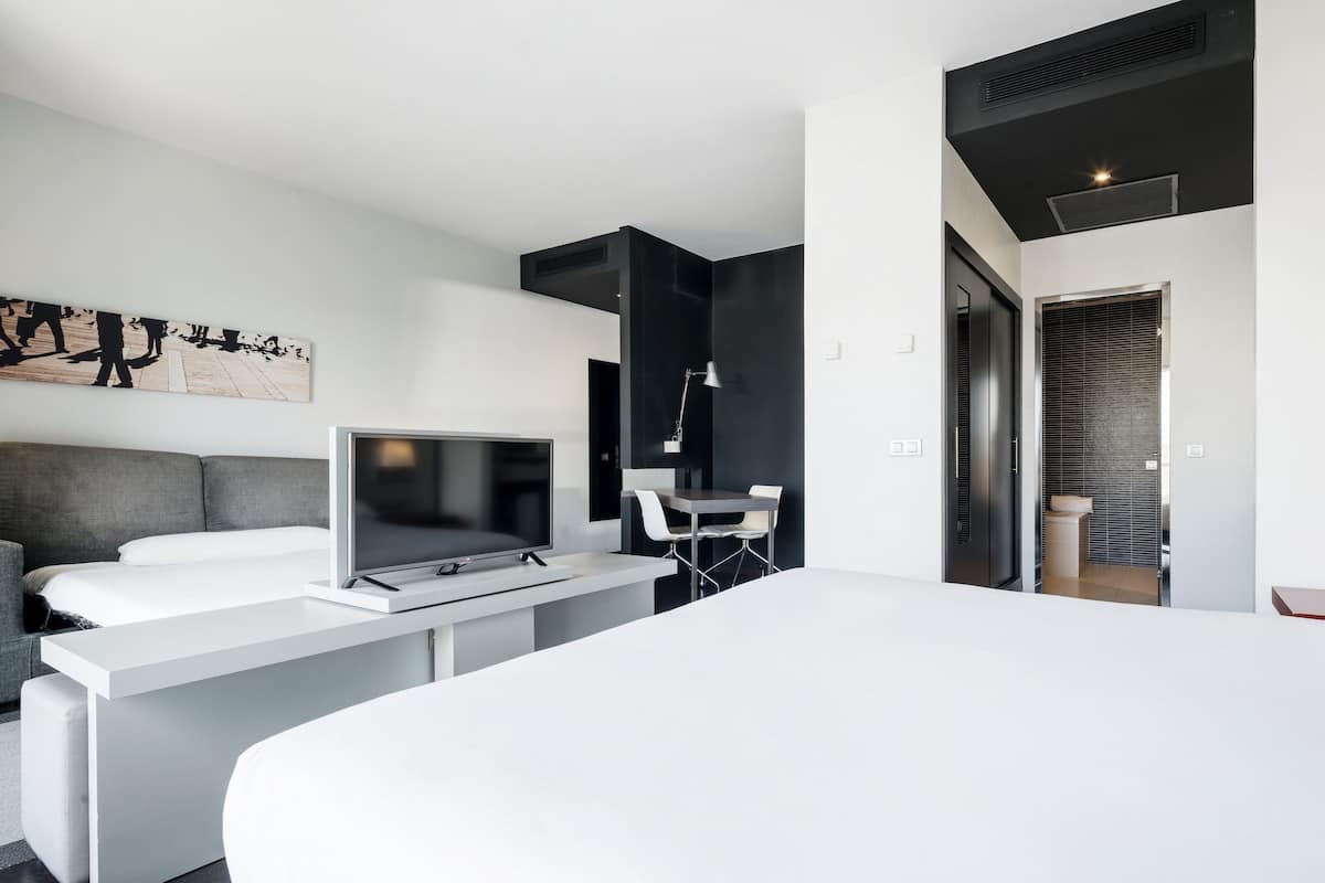 Family Room, Terrace | Down comforters, in-room safe, desk, laptop workspace