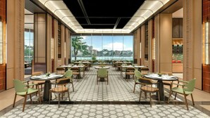 A modern dining area with round tables and chairs, large windows with a city view, and a patterned floor.