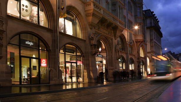 A historic building with ornate architecture, including arched windows and detailed stonework.