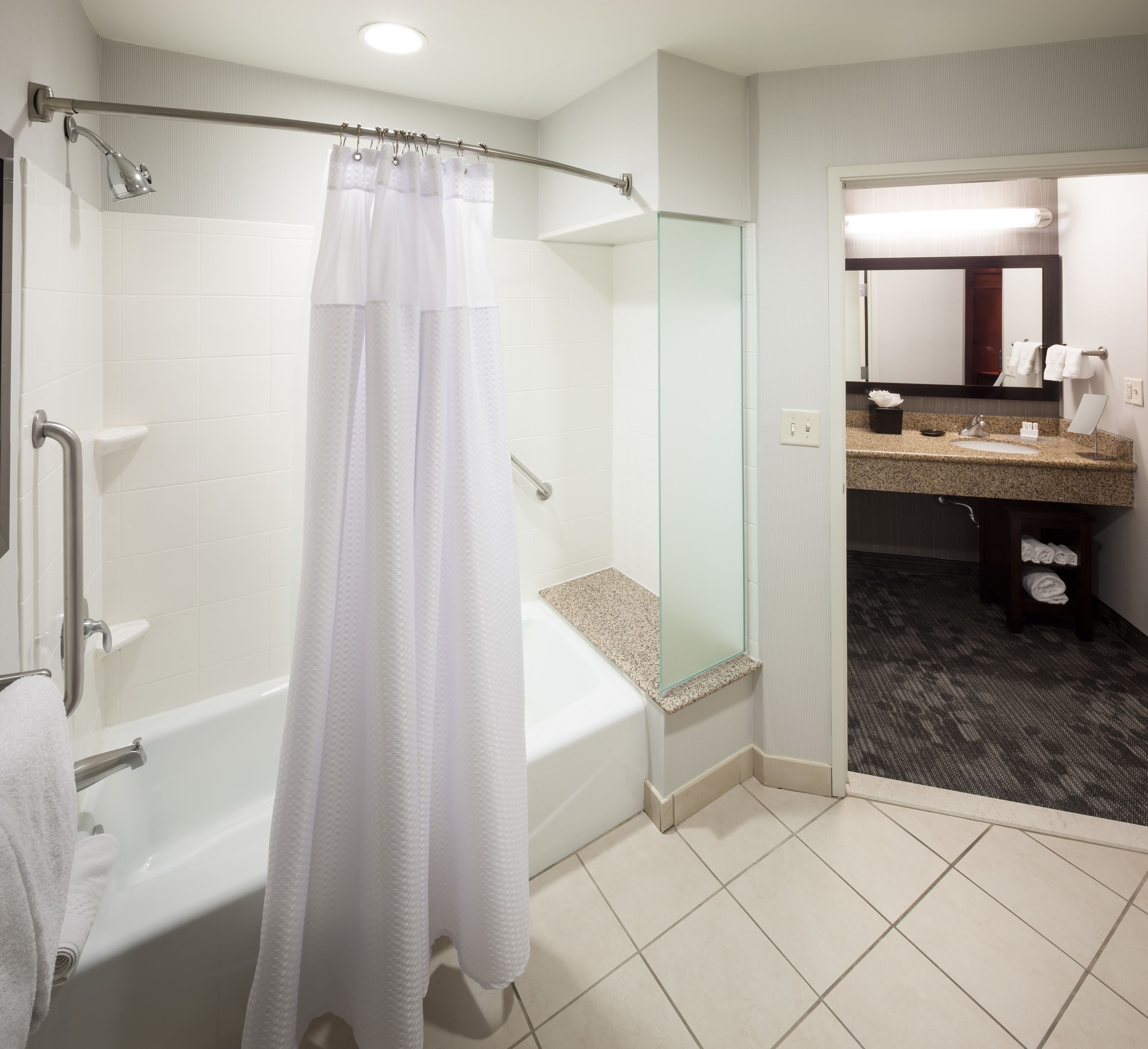 junior suite, 1 bedroom, non smoking, balcony | bathroom | combined shower/bathtub, free toiletries, hair dryer, towels