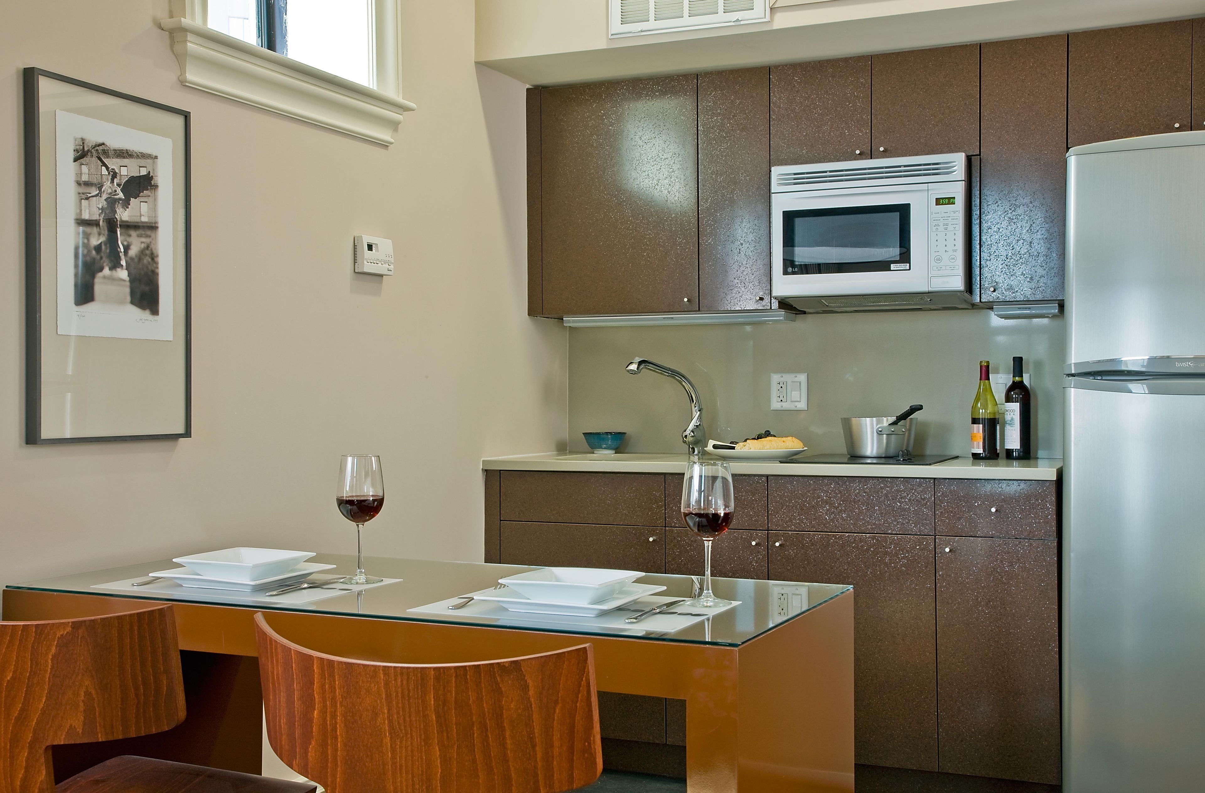 full-sized fridge, microwave, stovetop, coffee/tea maker