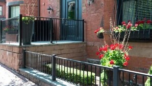 A brick building with a sign reading "The Inn". - The Inn At St Botolph (Boston)