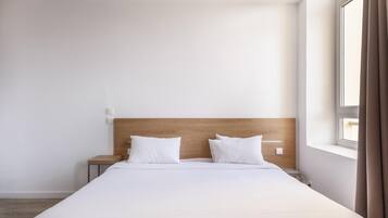 Desk, blackout drapes, soundproofing, iron/ironing board