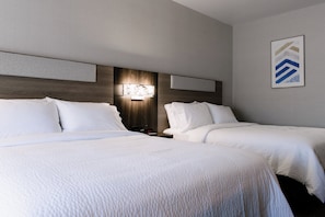 Premium bedding, desk, laptop workspace, blackout drapes