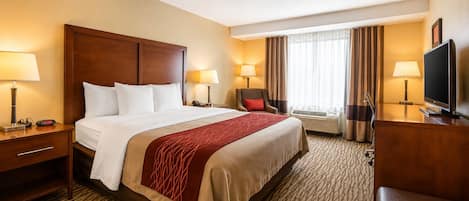 Premium bedding, desk, laptop workspace, blackout curtains