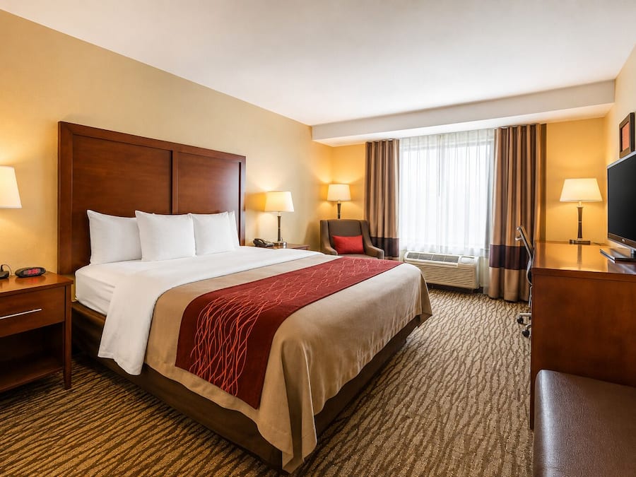 Premium bedding, desk, laptop workspace, blackout curtains