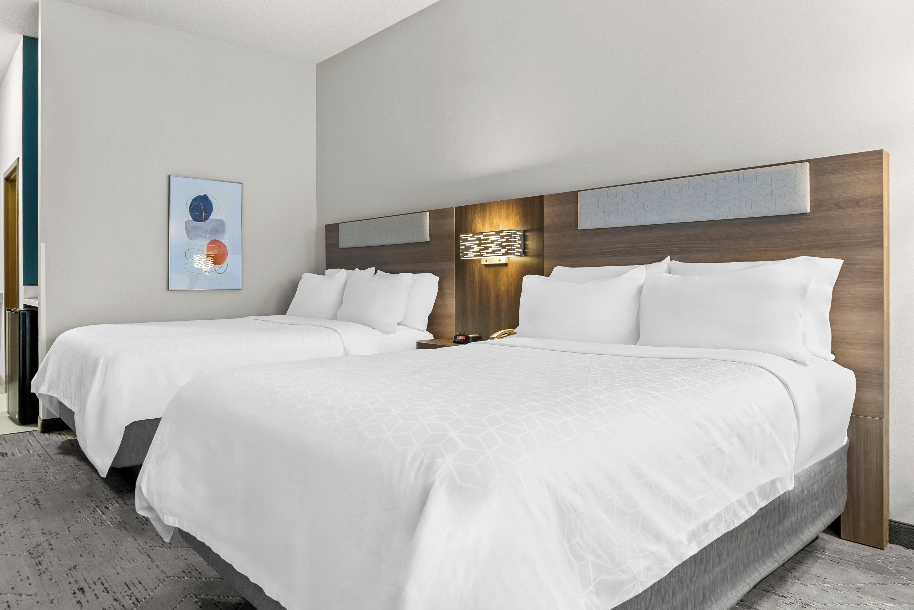 Premium bedding, pillowtop beds, desk, blackout drapes