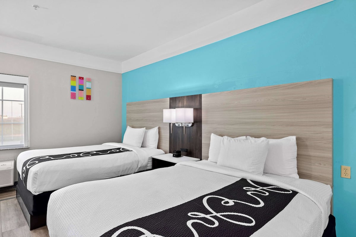 Premium bedding, pillow-top beds, desk, laptop workspace