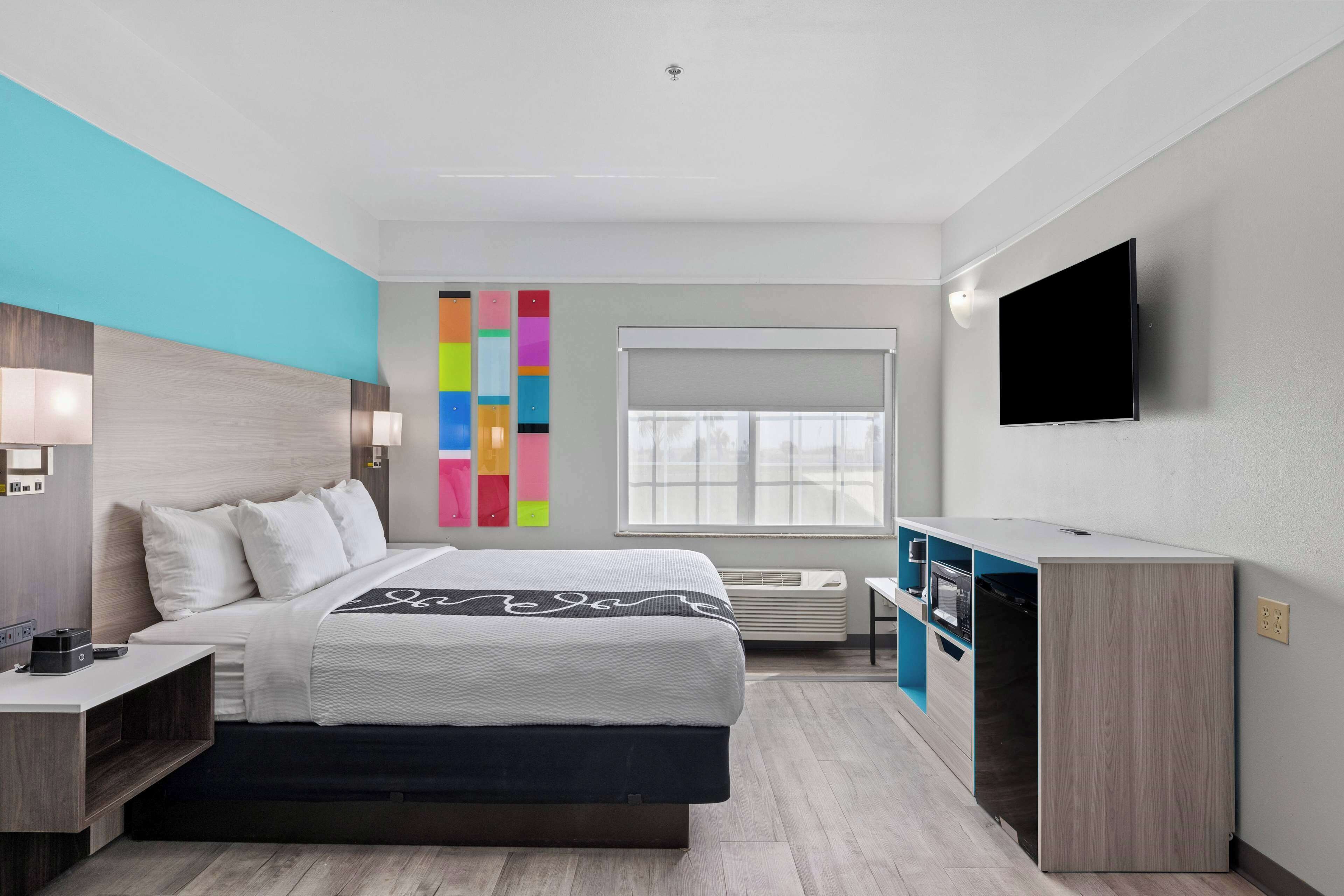 Premium bedding, pillow-top beds, desk, laptop workspace