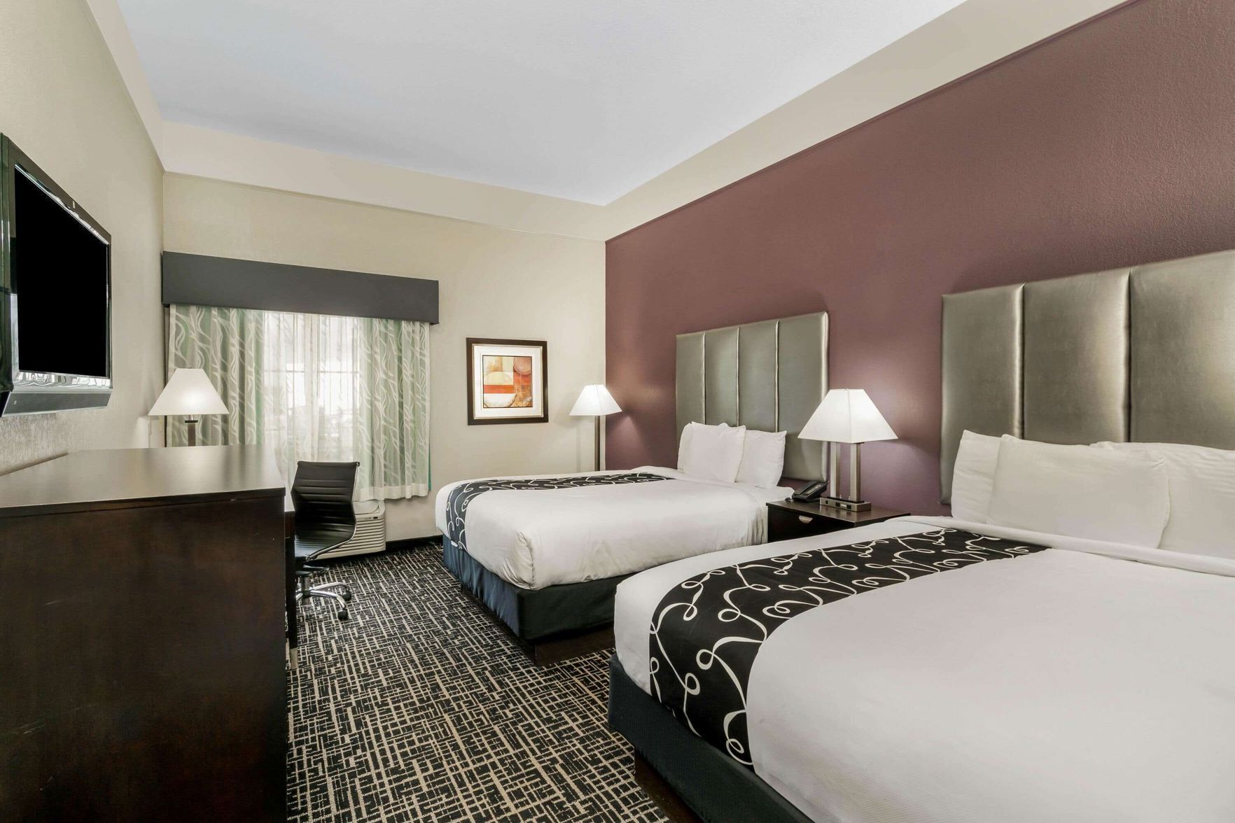 Premium bedding, desk, laptop workspace, blackout curtains