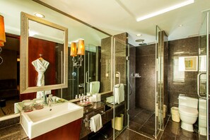 A modern bathroom with a large mirror, a glass-enclosed shower, a white sink, and a toilet. - Crowne Plaza Beijing Zhongguancun by IHG (Beijing)