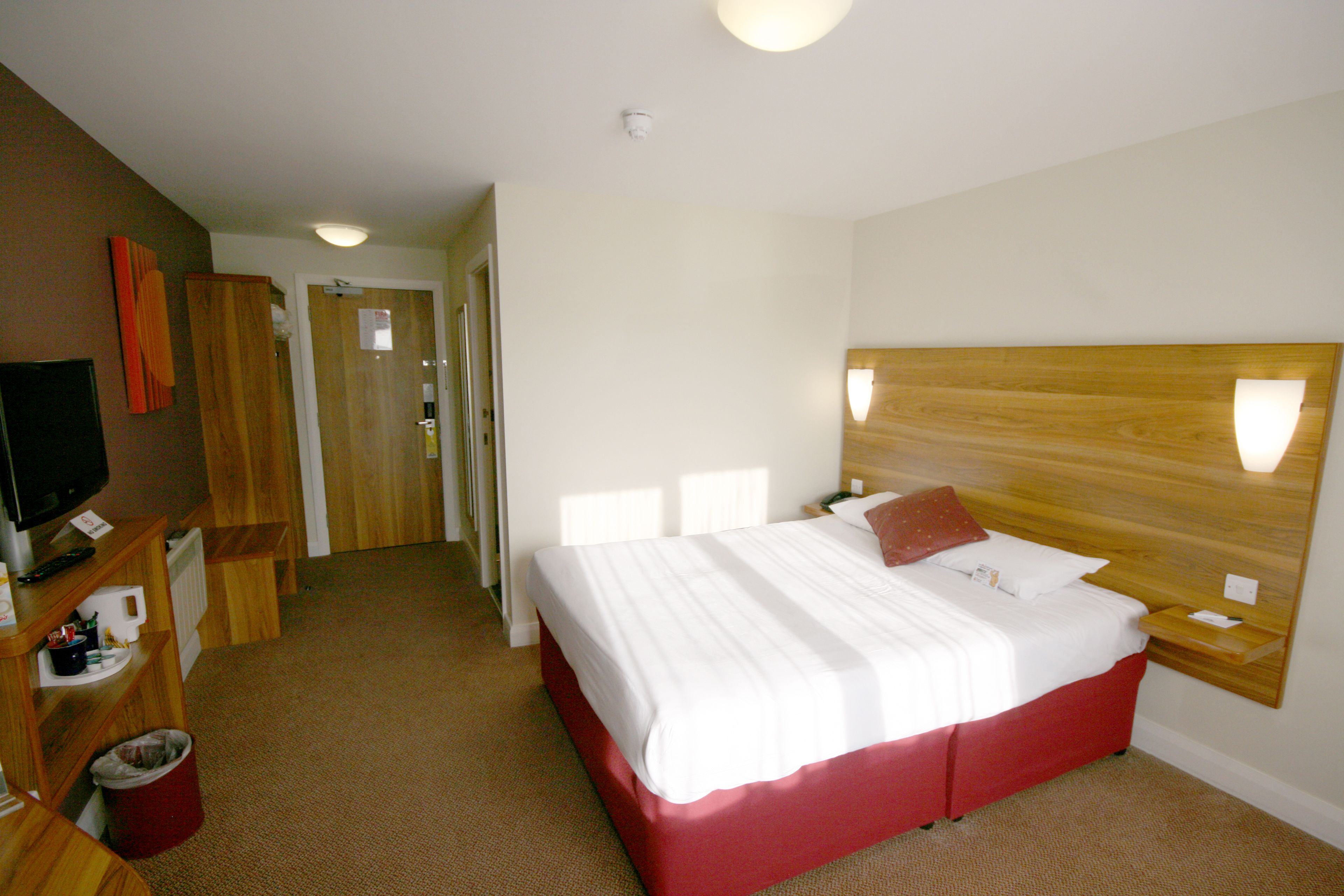 hypo-allergenic bedding, desk, laptop workspace, blackout curtains