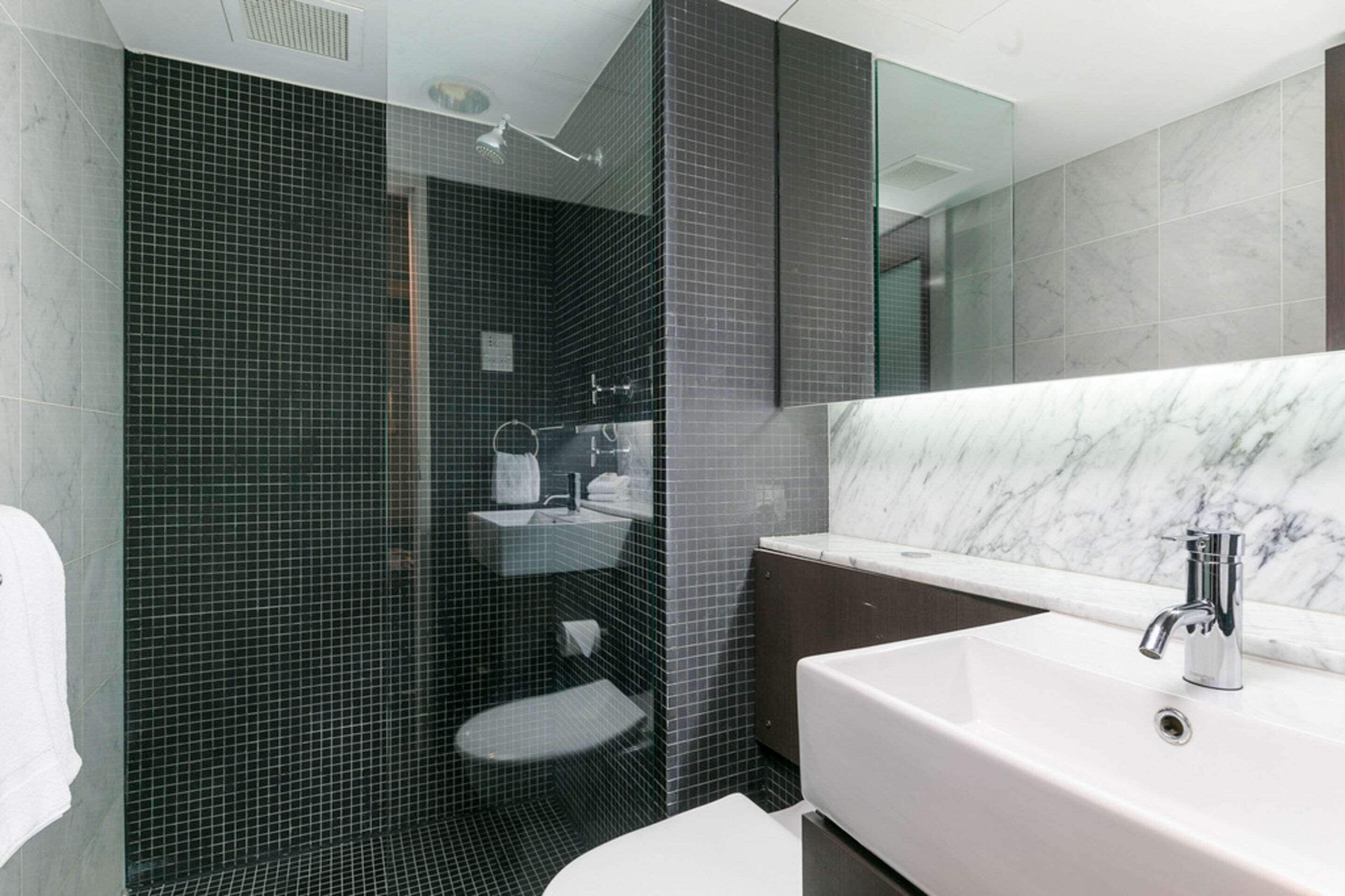 combined shower/bathtub, designer toiletries, hair dryer, dressing gowns