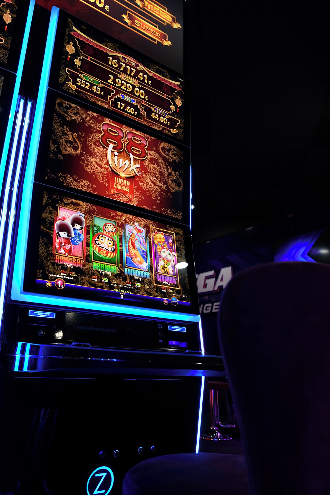 A slot machine with various game options and a closed cash box.