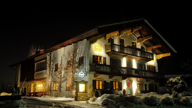 A two-story building with a balcony and a sign that reads "Bistrol". - Landhotel Binderhausl (Inzell)