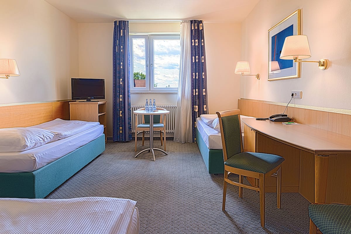 Classic Triple Room | Hypo-allergenic bedding, in-room safe, desk, free WiFi
