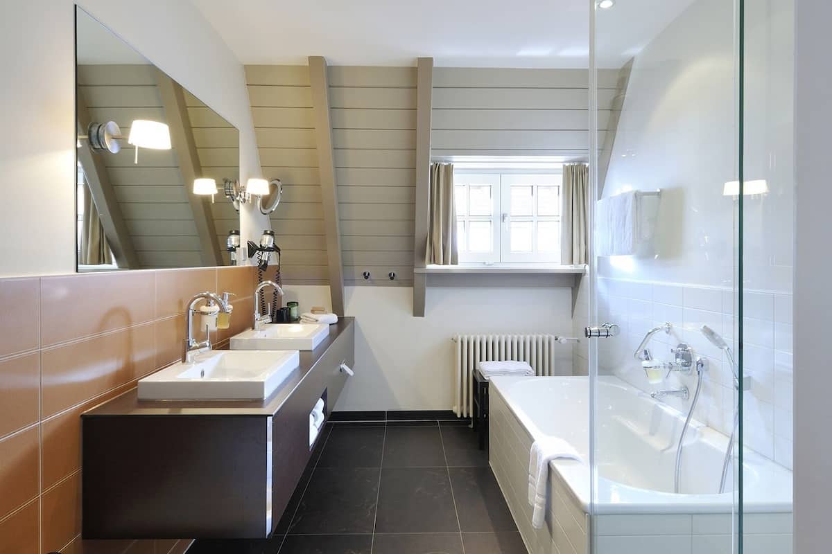 maisonette suite with terrace sauna | bathroom | free toiletries, hair dryer, bathrobes, towels