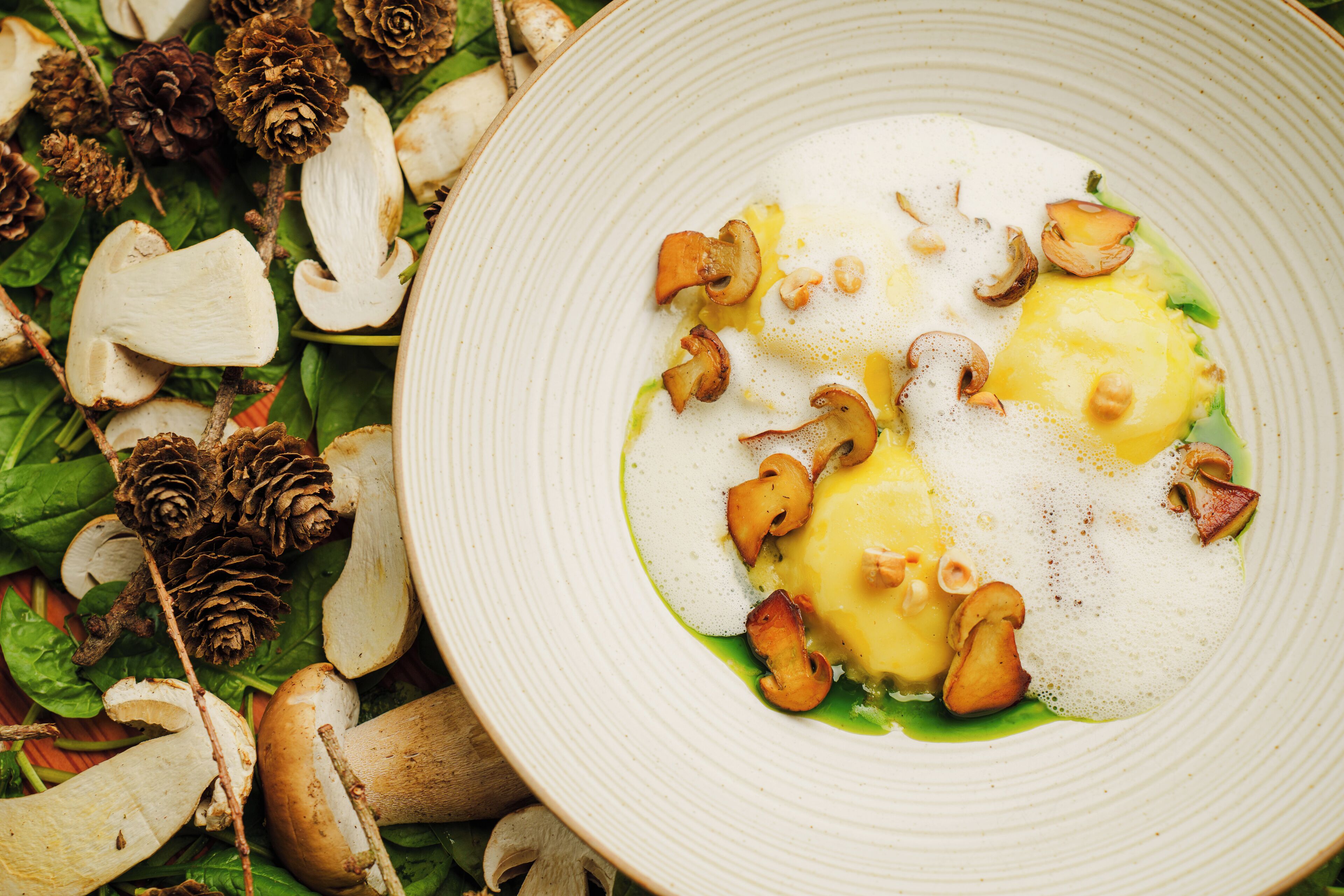 A plate of food with mushrooms and greens.
