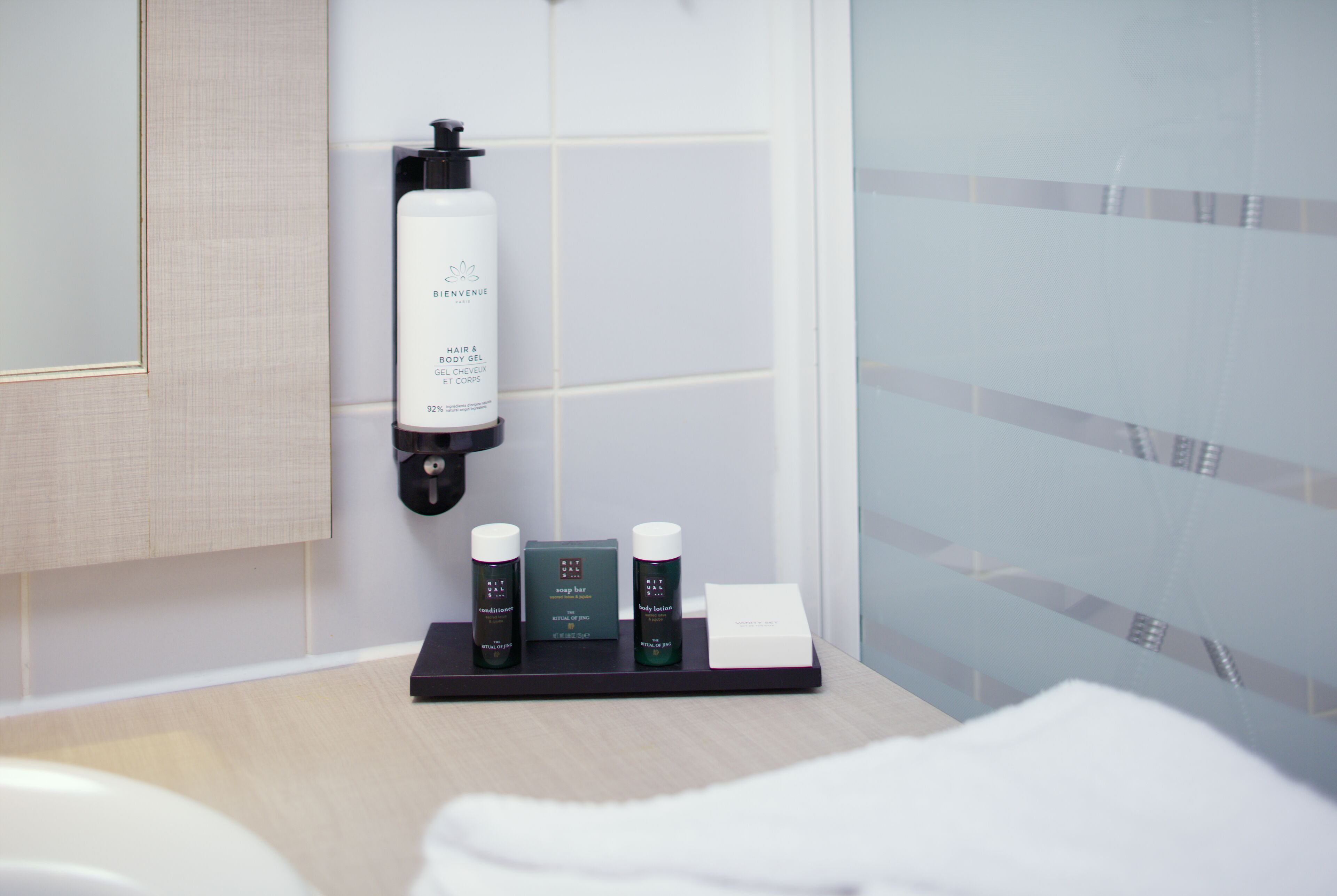 rainfall showerhead, eco-friendly toiletries, hair dryer, towels