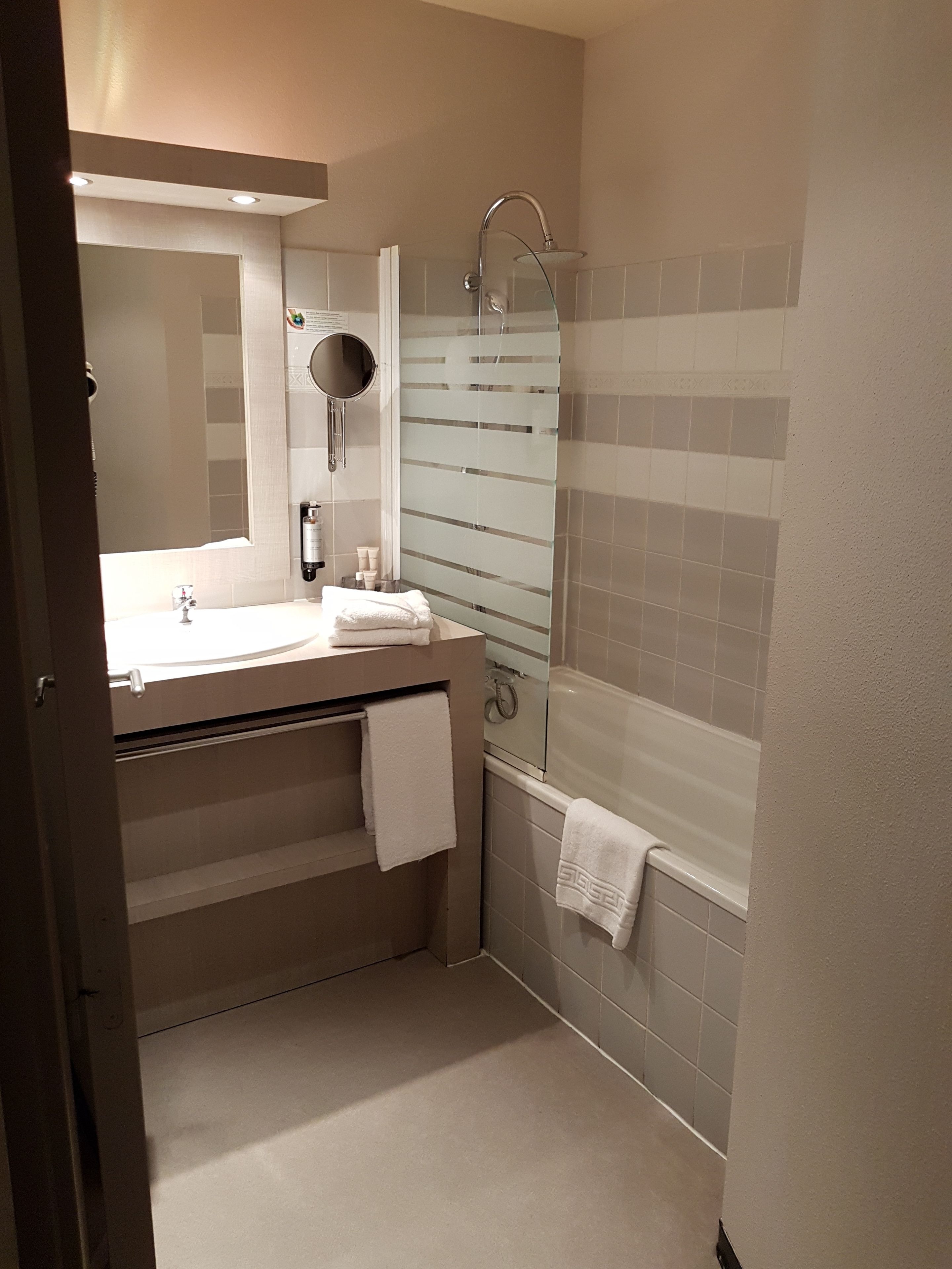 rainfall showerhead, eco-friendly toiletries, hair dryer, towels