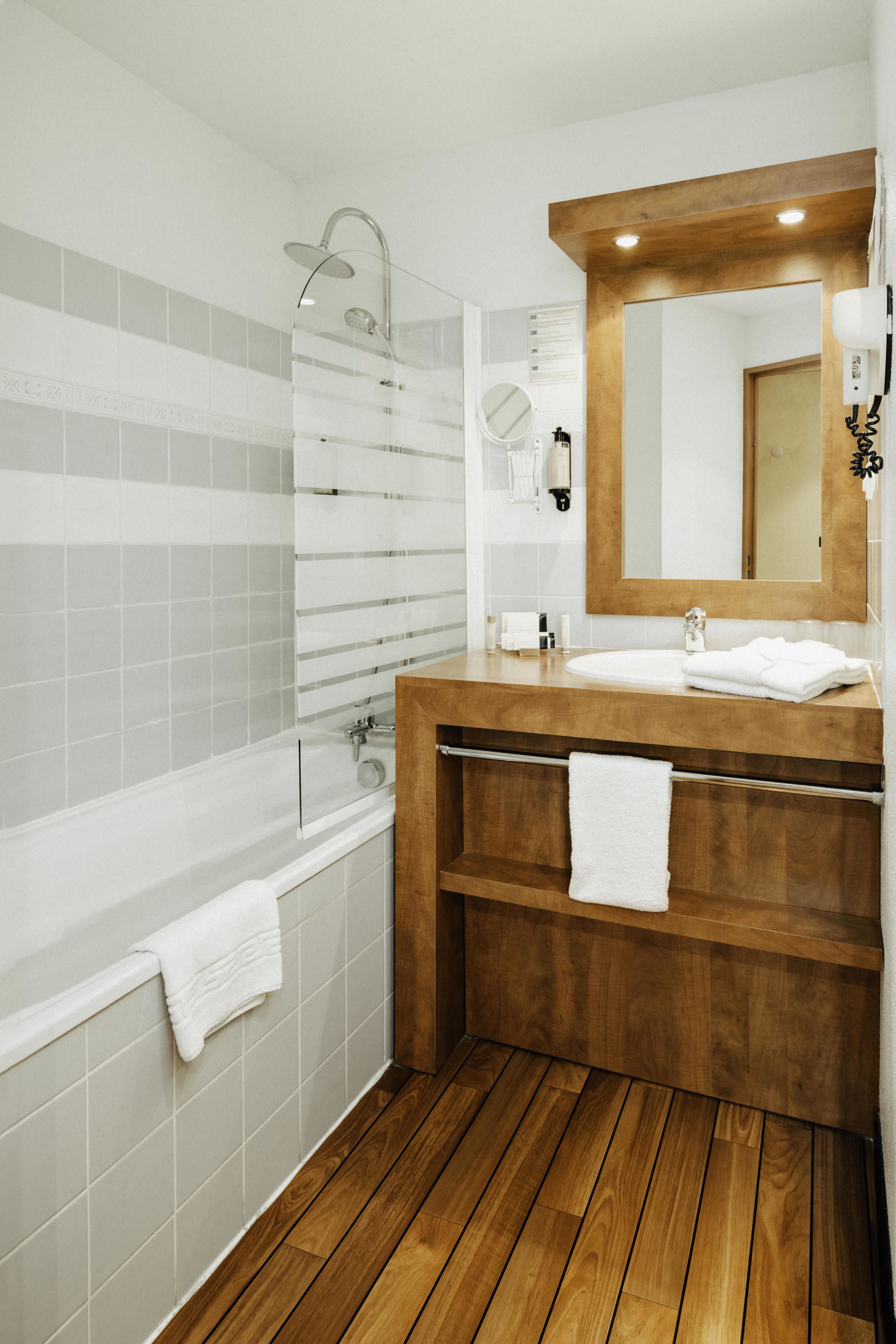 rainfall showerhead, eco-friendly toiletries, hair dryer, towels