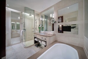 Separate tub and shower, designer toiletries, hair dryer, bathrobes