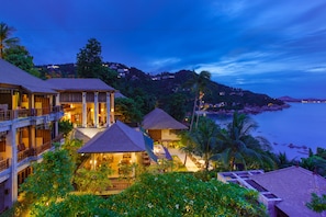 Experience the perfect blend of modern and traditional architecture amidst lush greenery and ocean views.