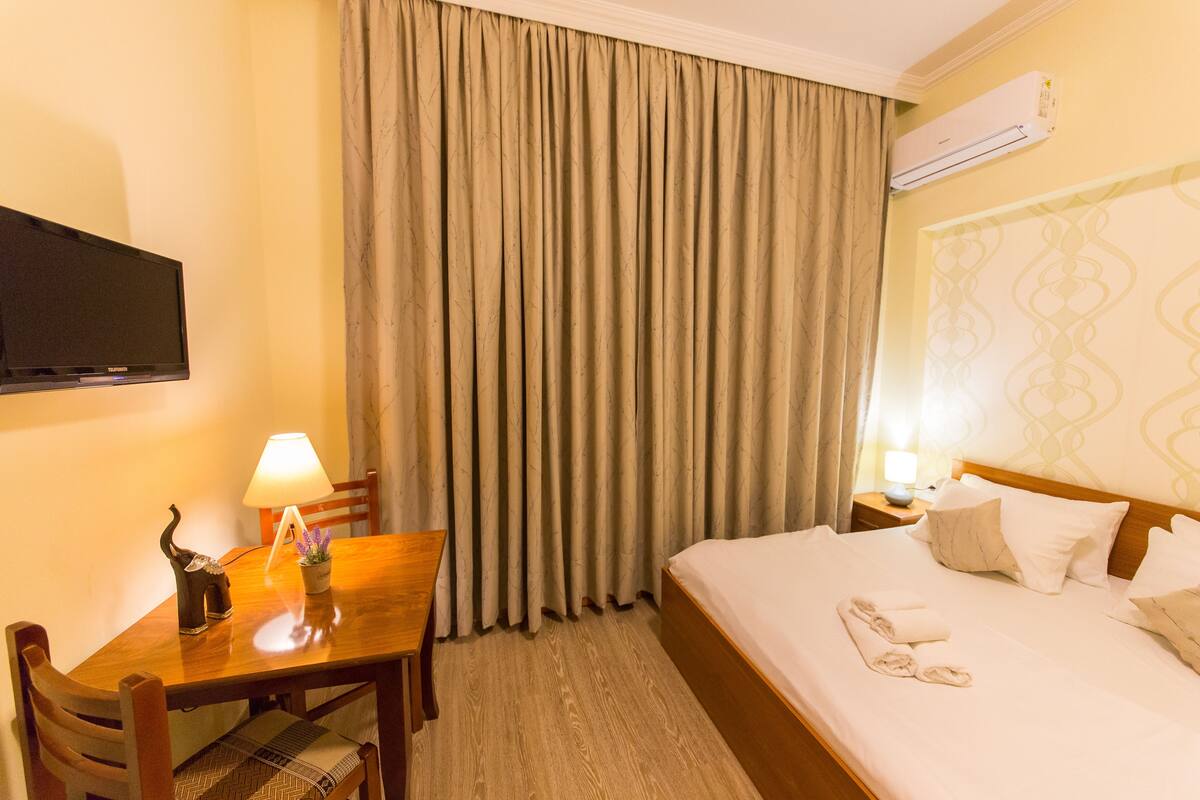 Economy Double Room, Balcony | In-room safe, desk, blackout drapes, iron/ironing board (on request)
