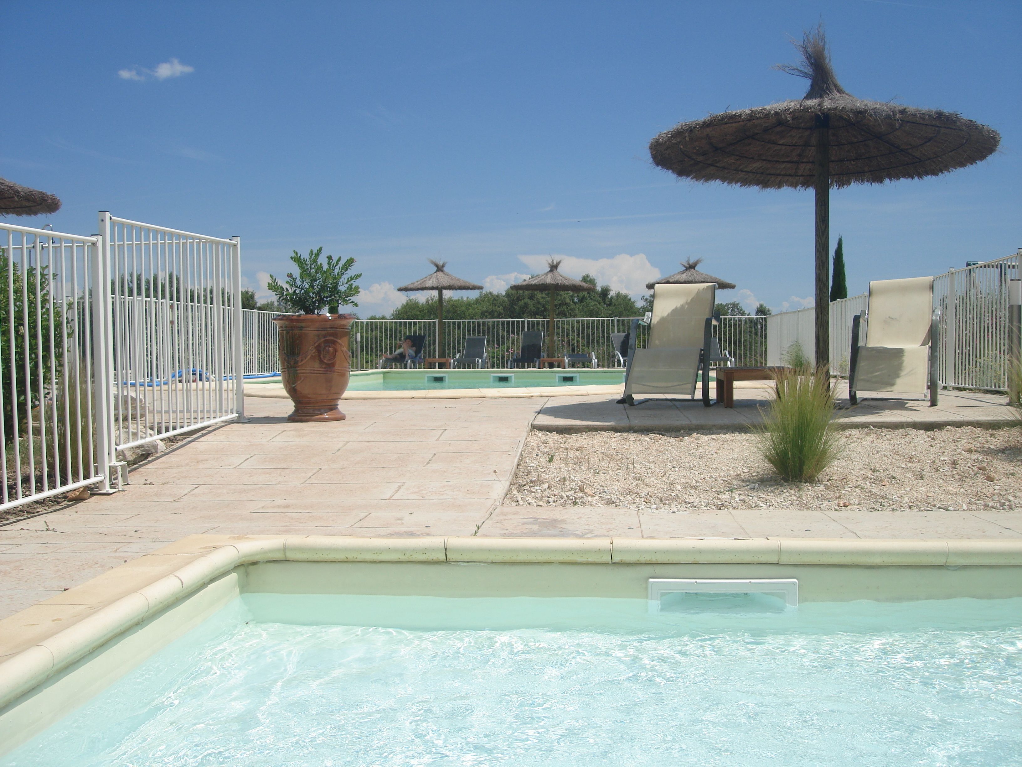 outdoor pool, pool umbrellas, pool loungers