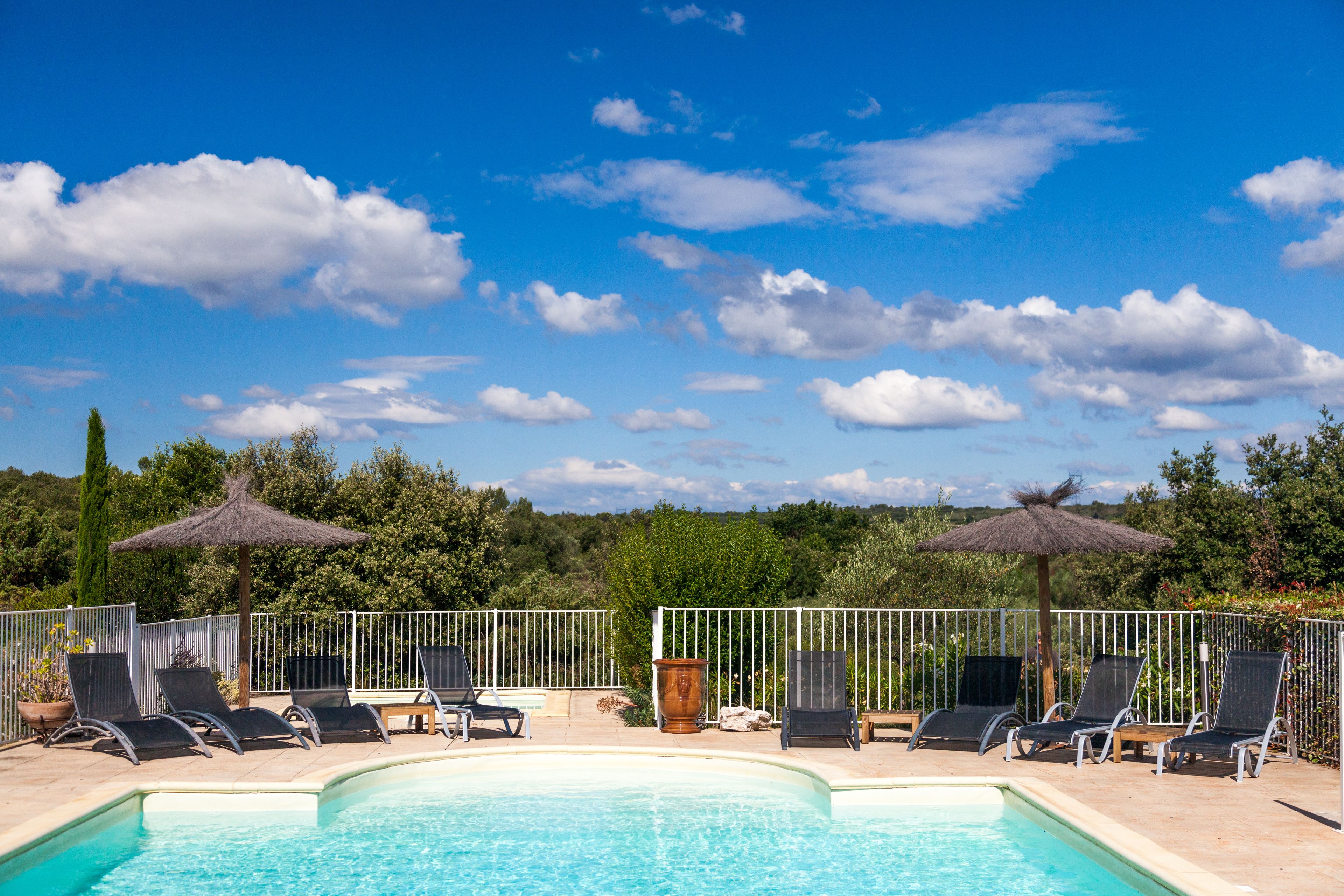 outdoor pool, pool umbrellas, pool loungers