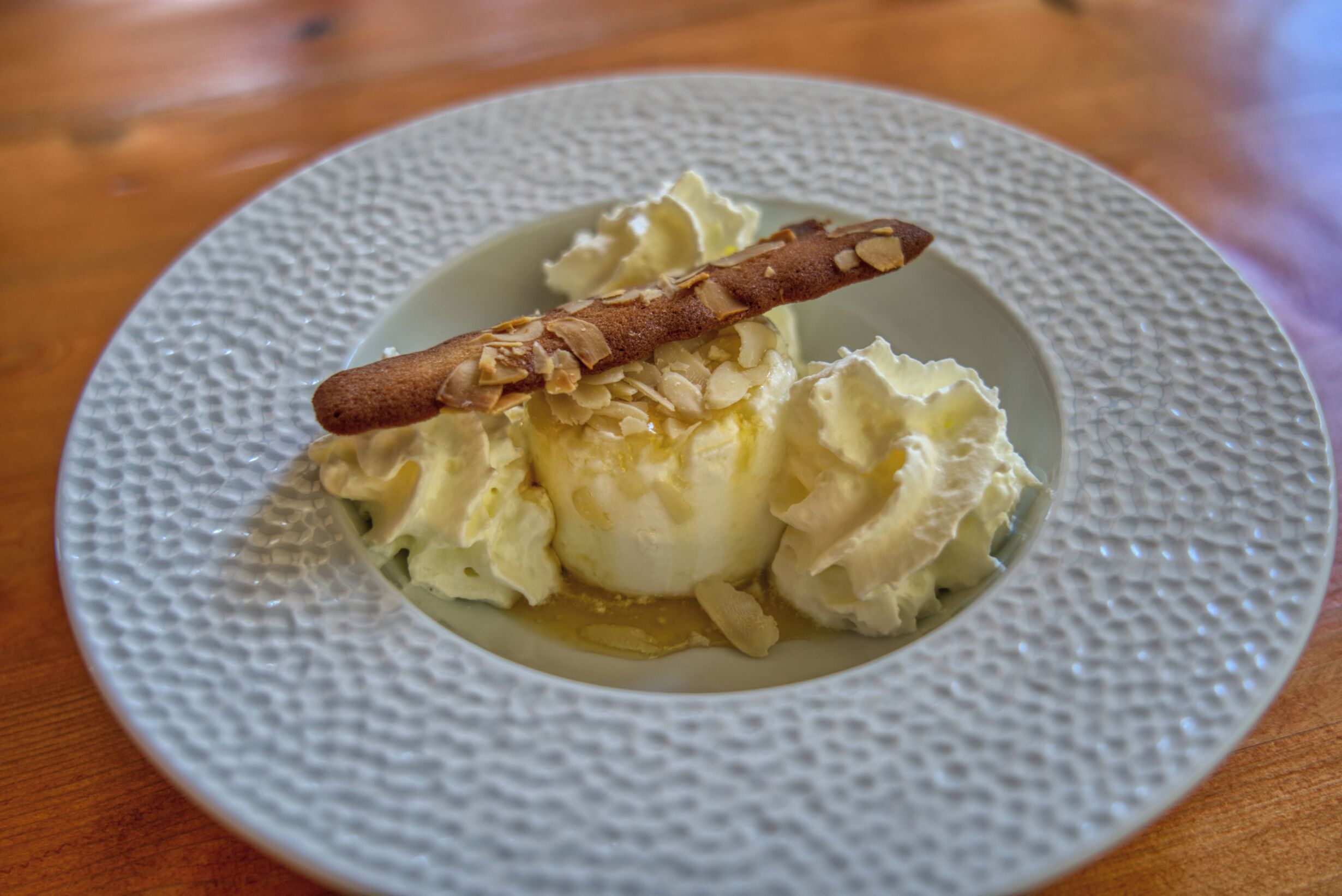 A dessert on a textured plate.