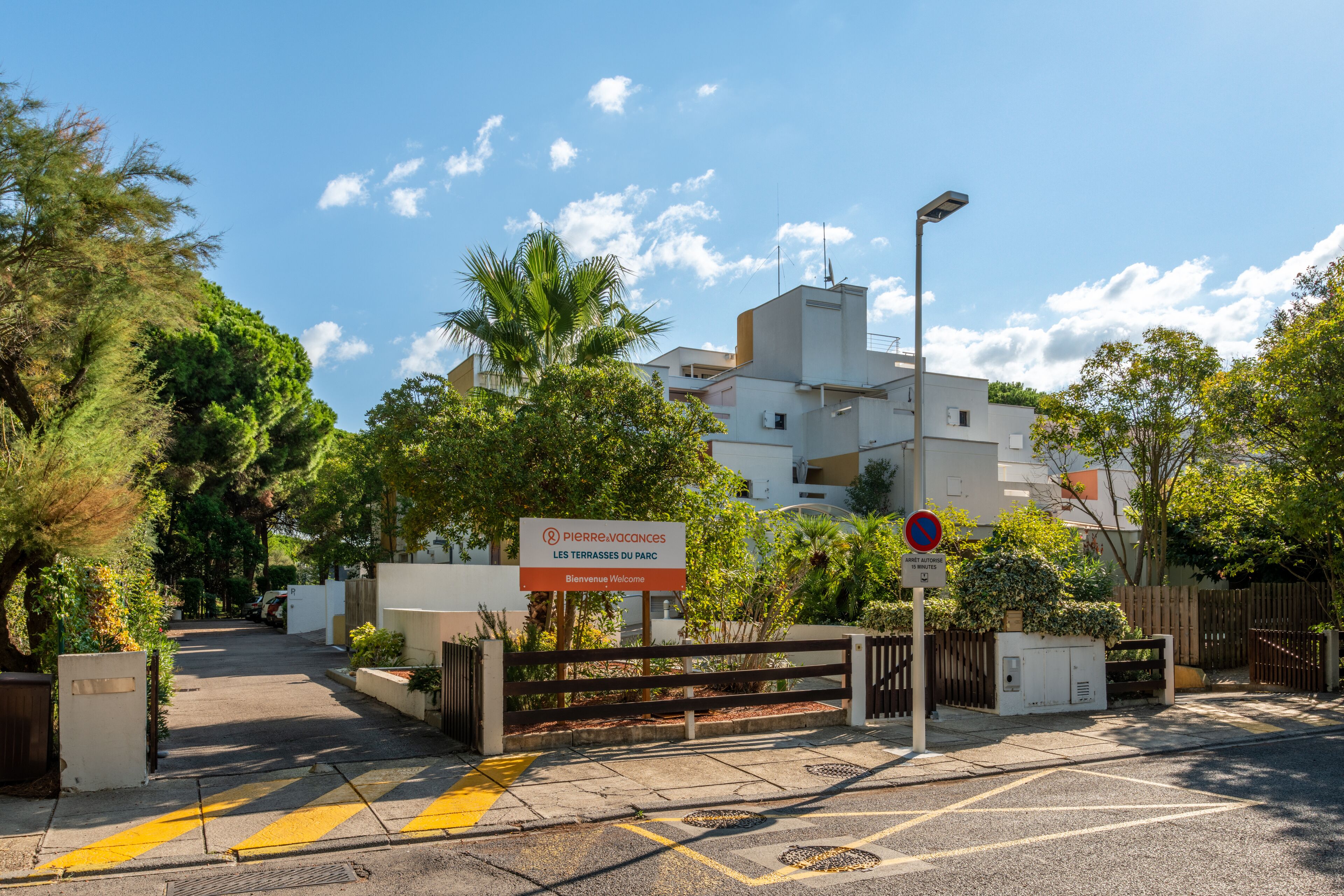 A gated entrance to a building with a sign reading "Pierre Vacances Les Terrasses du Parc."