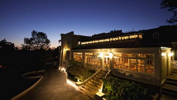 Breakfast, dinner served; local cuisine, garden views