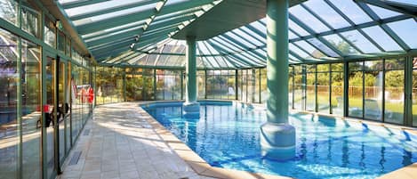 Indoor pool, pool umbrellas, pool loungers