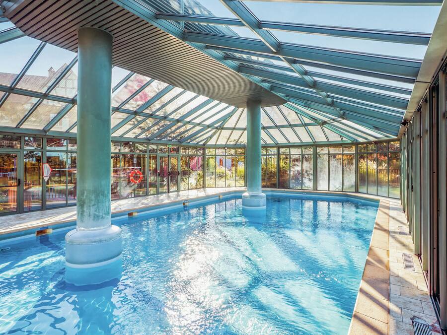 Indoor pool, pool umbrellas, pool loungers