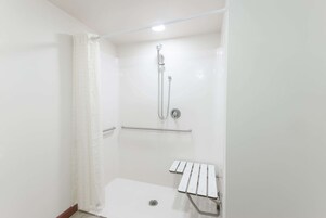 Room, 1 King Bed, Accessible, Non Smoking (Mobility Roll-In Shower) | Bathroom | Combined shower/tub, hair dryer, towels, soap