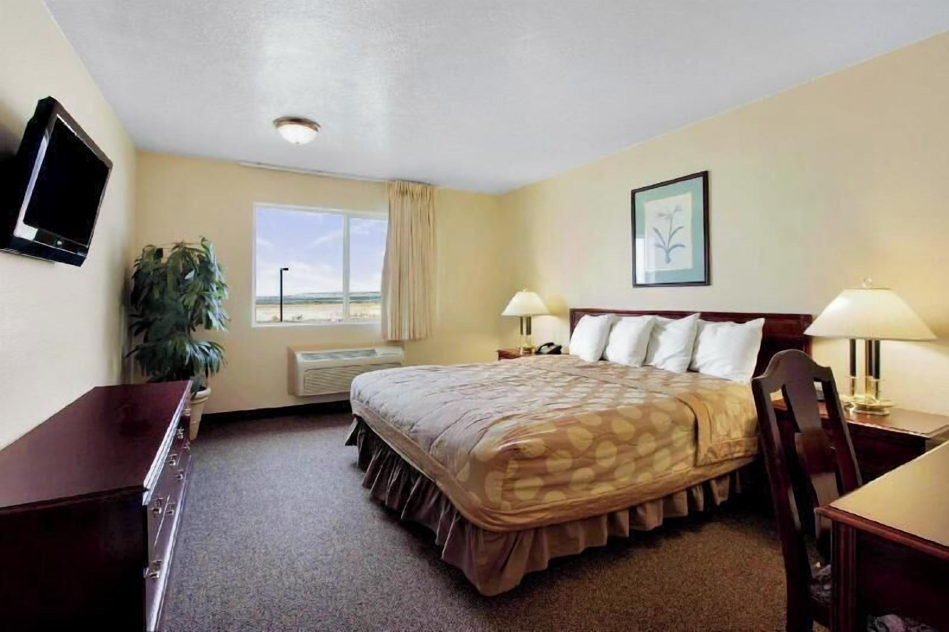 Desk, laptop workspace, blackout curtains, iron/ironing board