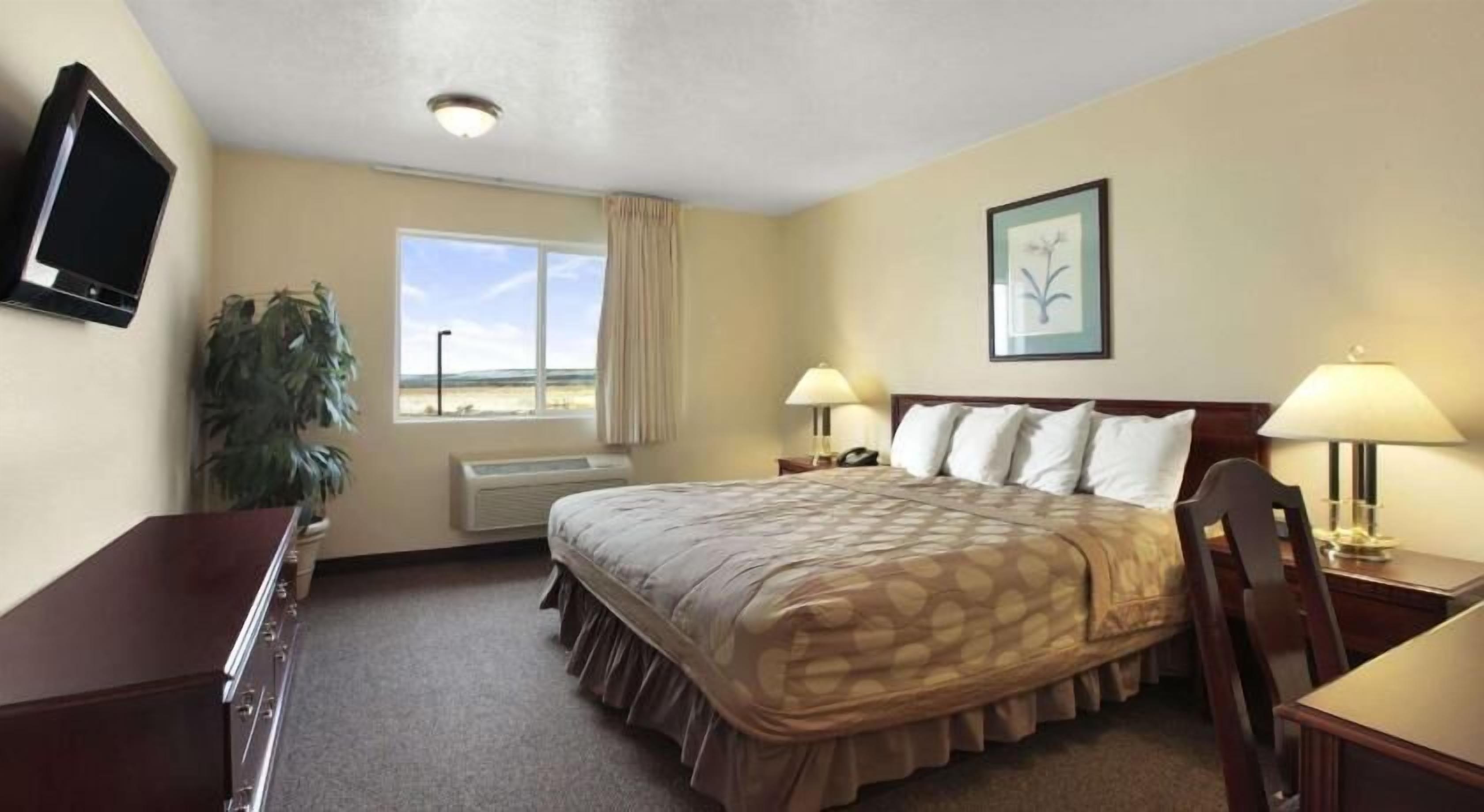 Desk, laptop workspace, blackout curtains, iron/ironing board