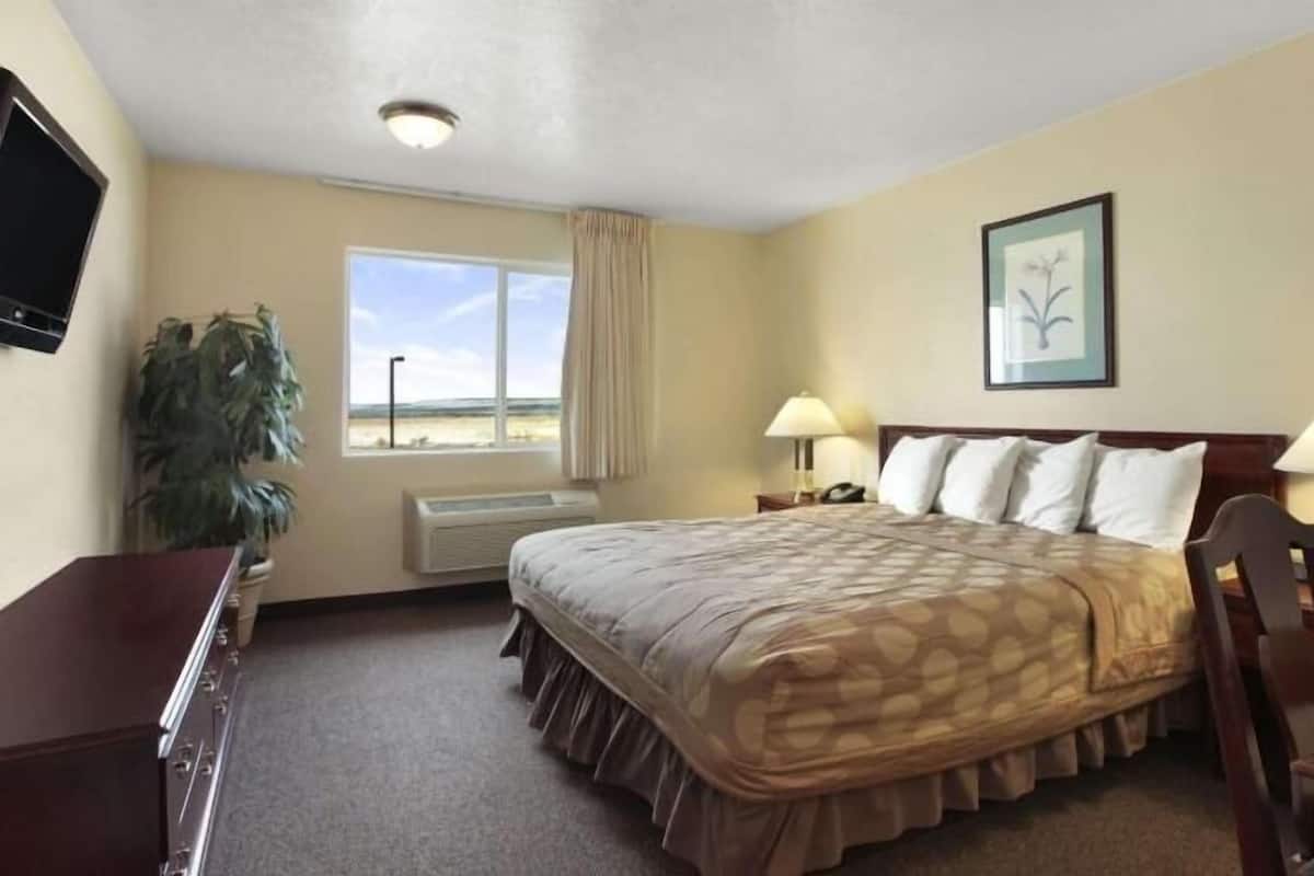 Desk, laptop workspace, blackout curtains, iron/ironing board