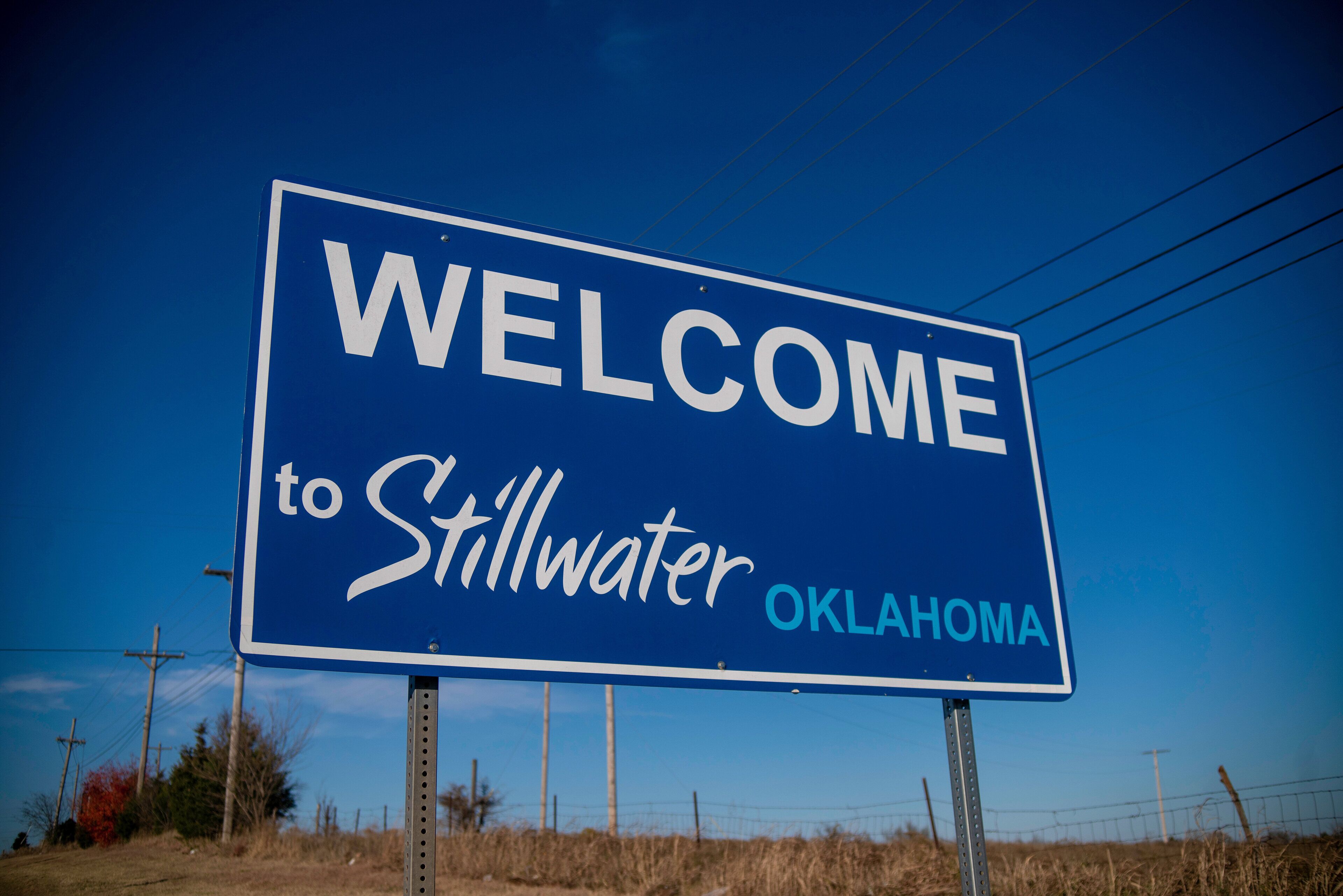 A blue welcome sign for Stillwater, Oklahoma.