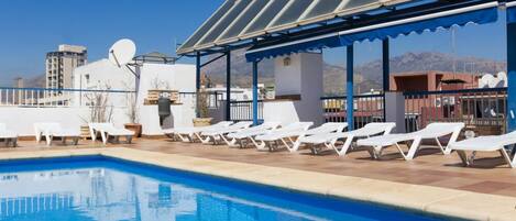 Outdoor pool, pool umbrellas, sun loungers