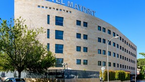 A modern hotel building with the name "HOTEL MAYDRIT" on the facade.