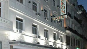 A hotel with a classic facade, multiple windows, and a prominent sign. - Hotel Napoleon (Buenos Aires)