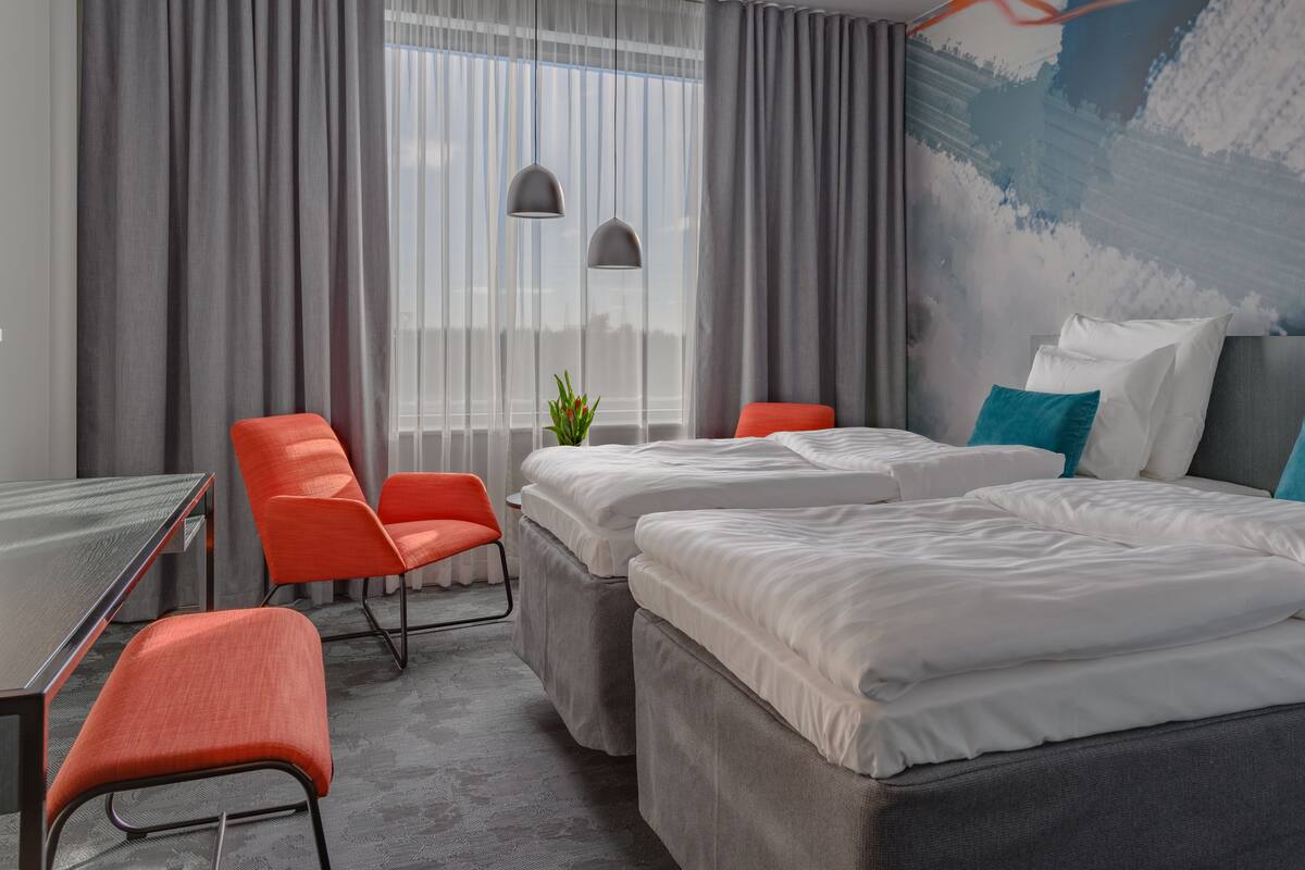 Standard Twin Room (Wing) | Minibar, in-room safe, desk, laptop workspace